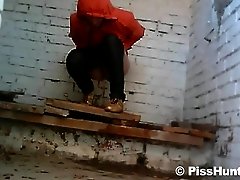 Sexy babe pissing in the ugly public toilet