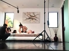 Behind the scenes look at a threesome with two busty babes
