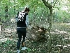 Hot girl peeing in public while walking in the forest. WetKelly