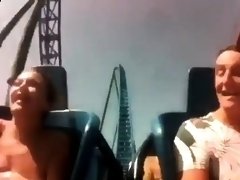 Cute amateur teen having fun on a roller coaster ride